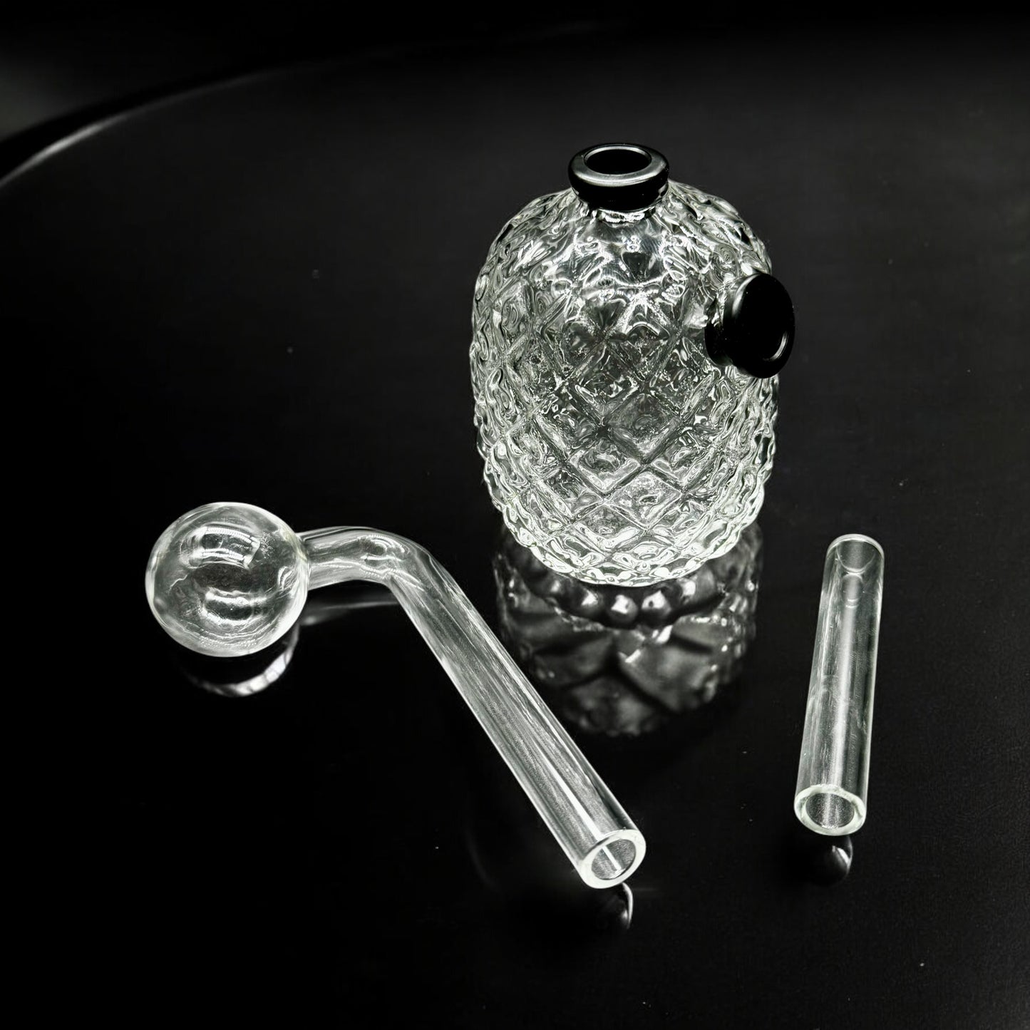 Disassembled 4-inch oil burner bubbler with clear glass parts including diamond-textured base, downstem, and bowl