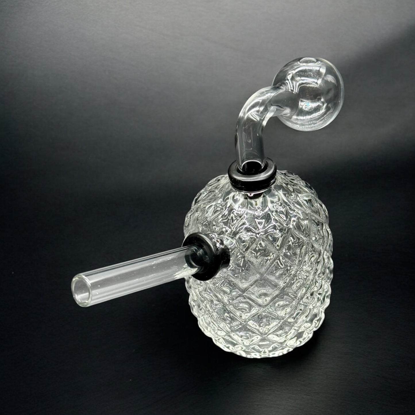 Top-down view of 4” oil burner glass bubbler showing textured body and angled removable mouthpiece