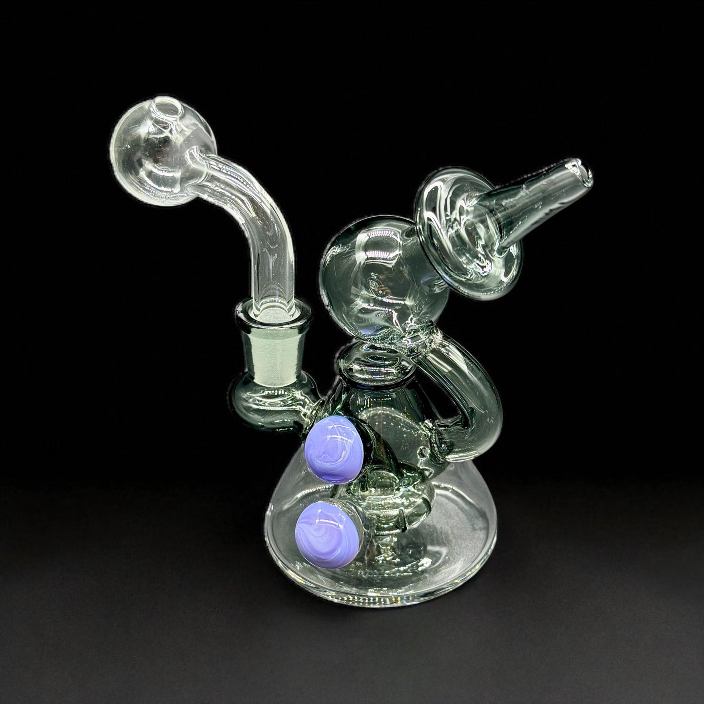 Glass smoking device with two outlets on a black background
