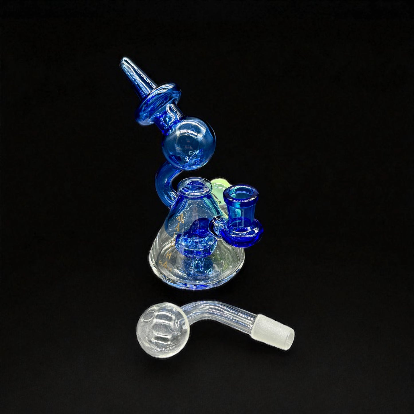 Glass smoking device with blue and clear components on a black background
