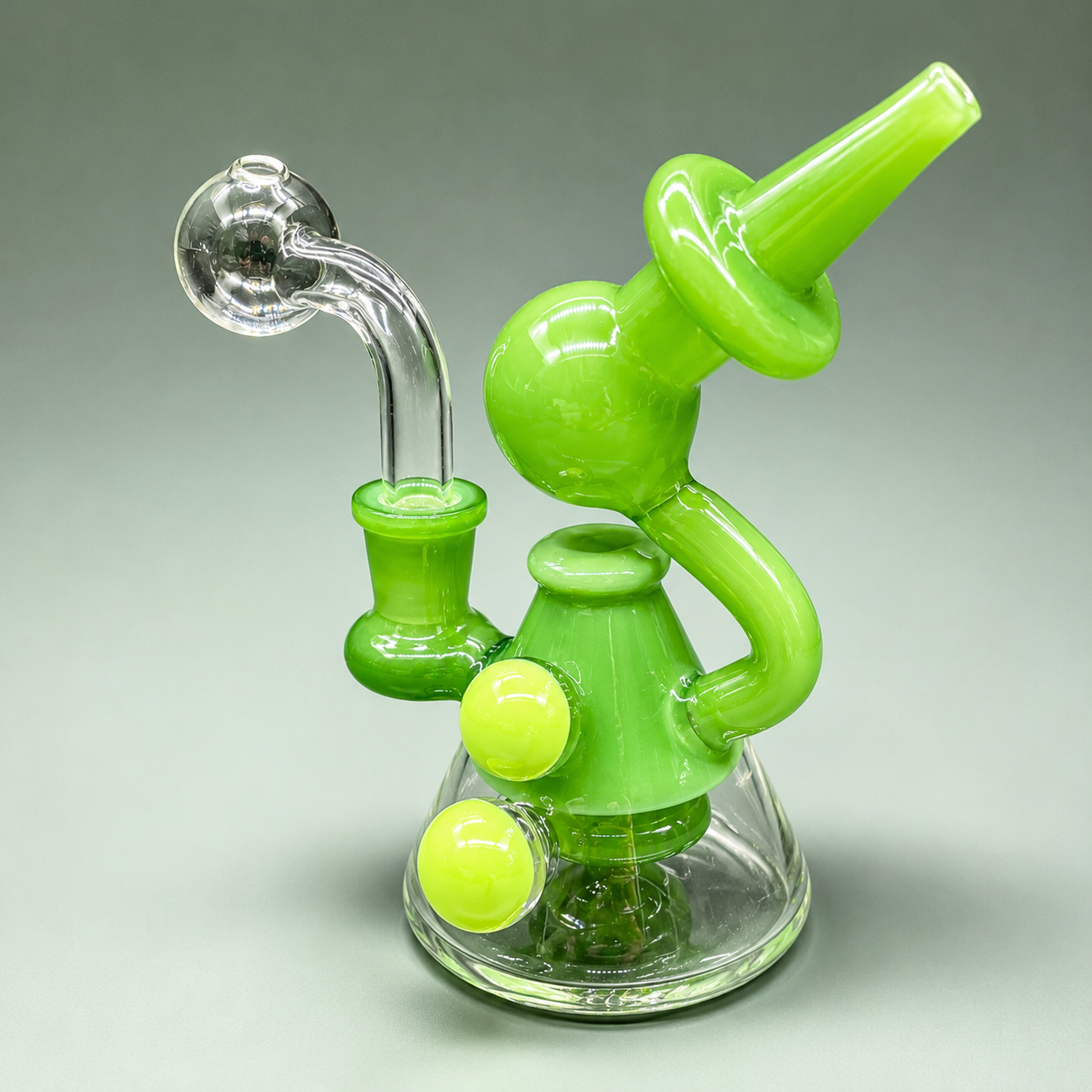 Green glass smoking device on a gray background