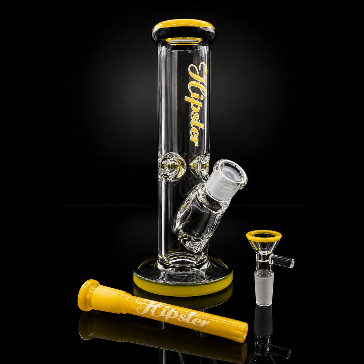 A clear glass water pipe with yellow accents and a yellow mouthpiece, shown on a black reflective background. The main body has the brand name 'Hipster' printed in yellow script, and a separate yellow mouthpiece is placed in front.