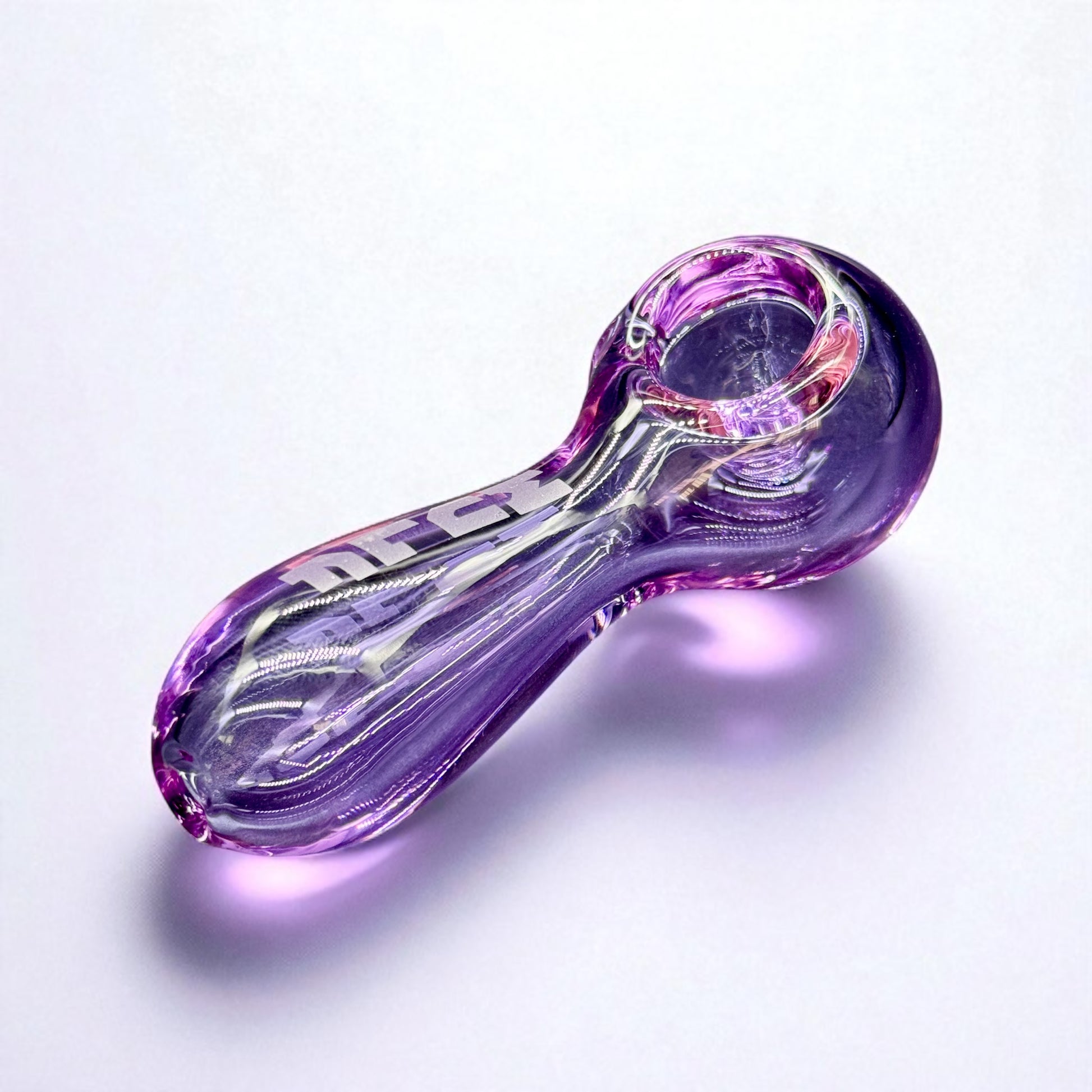 Purple glass pipe on a white background