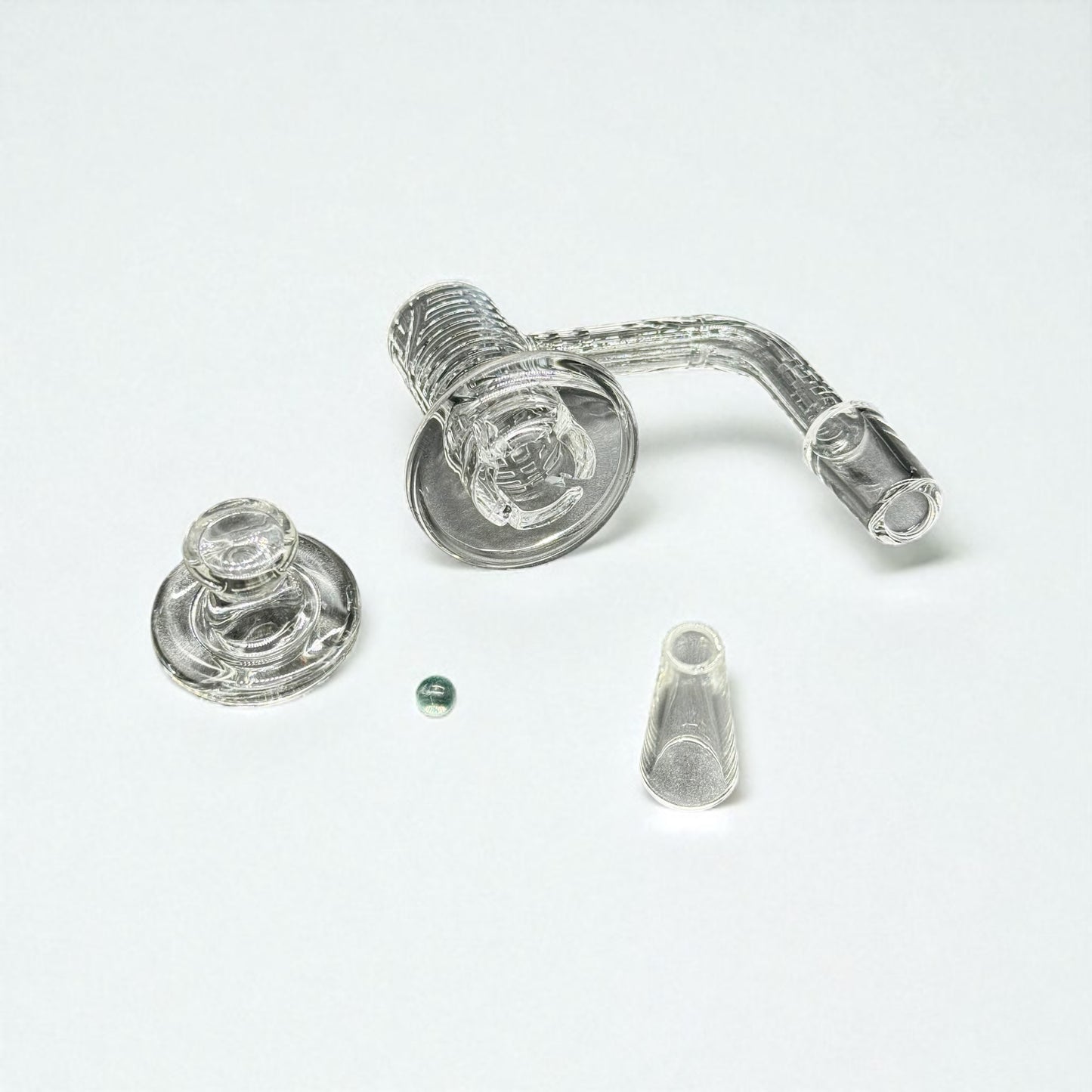 Glass smoking accessory set on a white background