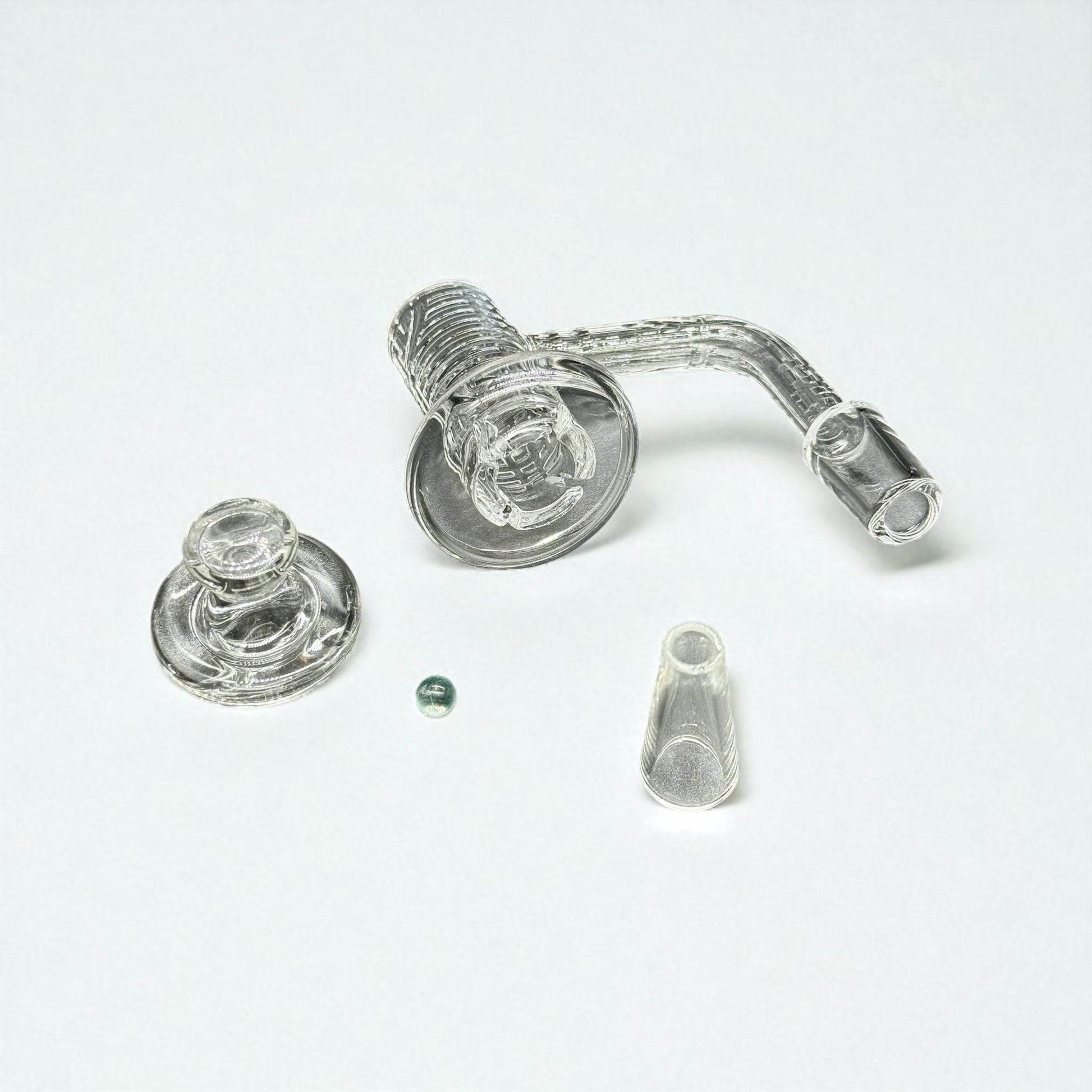 Glass smoking accessory set on a white background