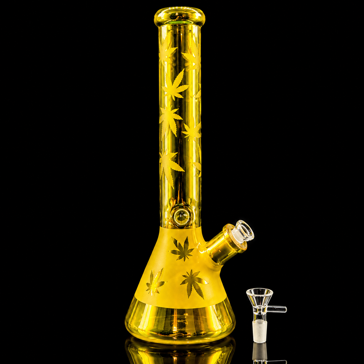 Yellow glass bong with cannabis leaf designs on a black background