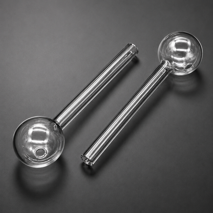 Two clear glass pipes on a dark gray background