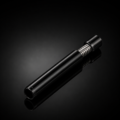 A sleek black cylindrical metal accessory with a textured silver threaded section, photographed diagonally on a reflective black studio background.
