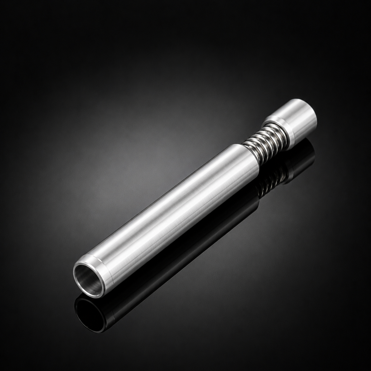 A polished silver metal cylindrical component with a threaded section, photographed diagonally on a reflective black studio background.