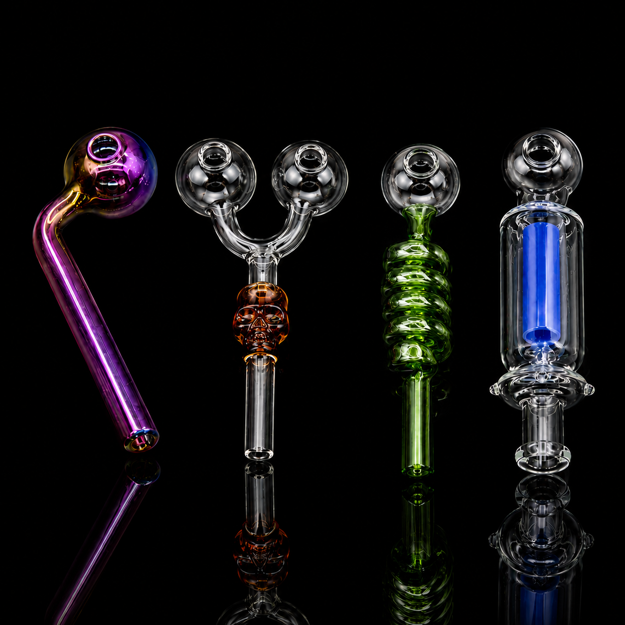 Four glass water pipes with different colored and textured sections, displayed on a reflective black background.