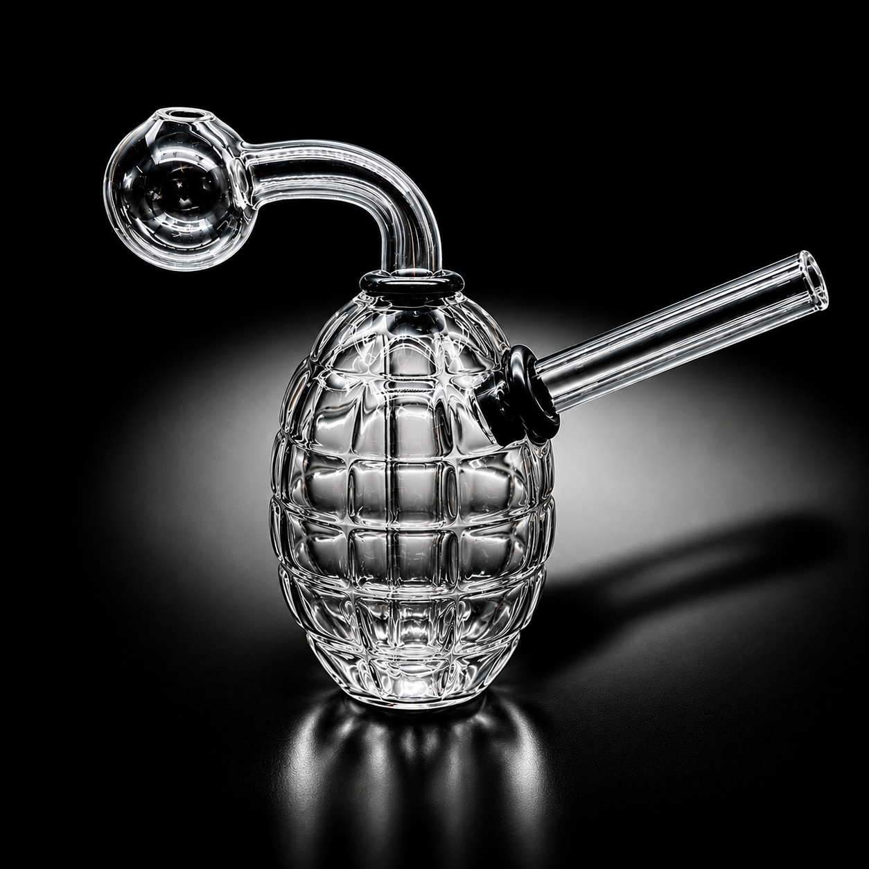 Glass smoking device shaped like a grenade on a black background