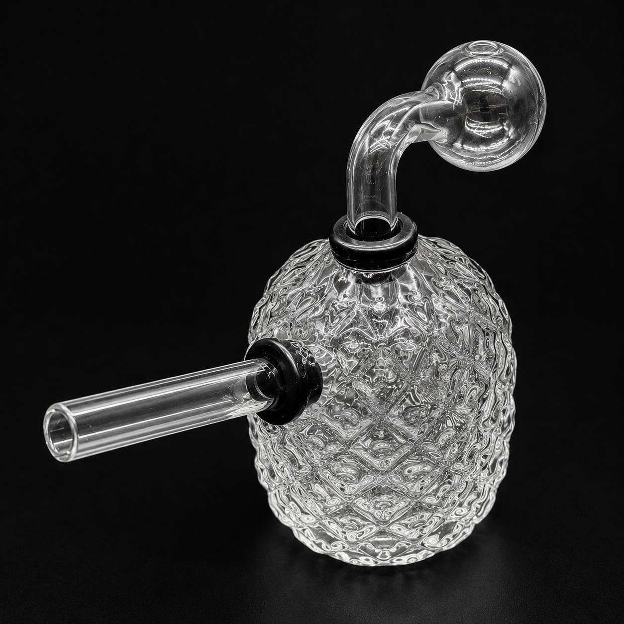 Clear glass smoking device with intricate patterns on a black background