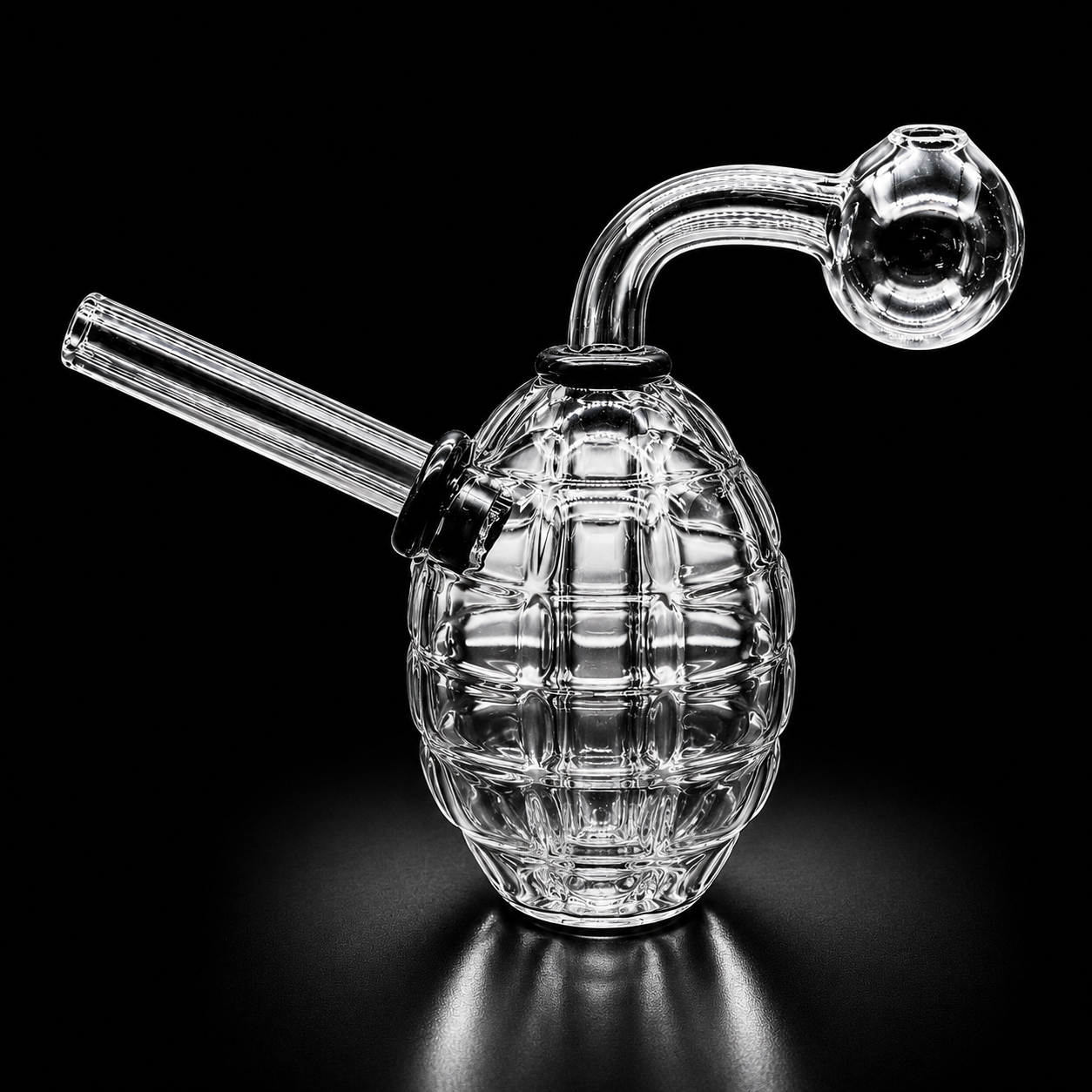 Glass smoking device shaped like a grenade on a black background