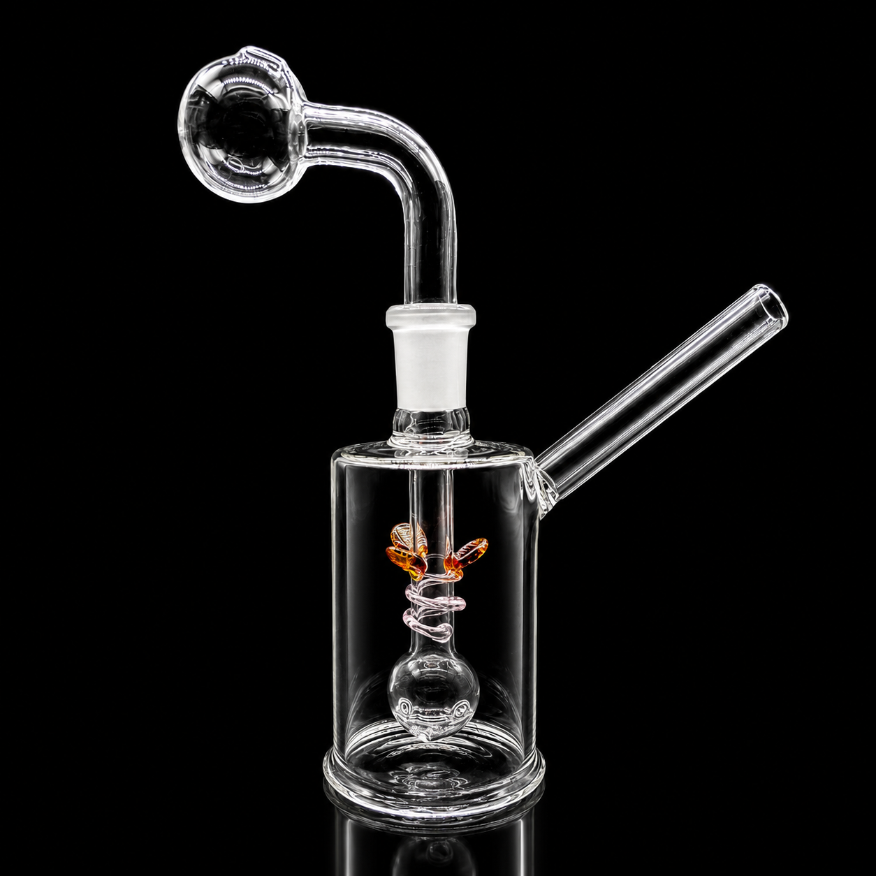 Clear glass water pipe with spiral design on a black background