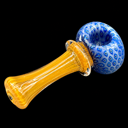 Glass pipe with orange stem and blue bowl on a black background