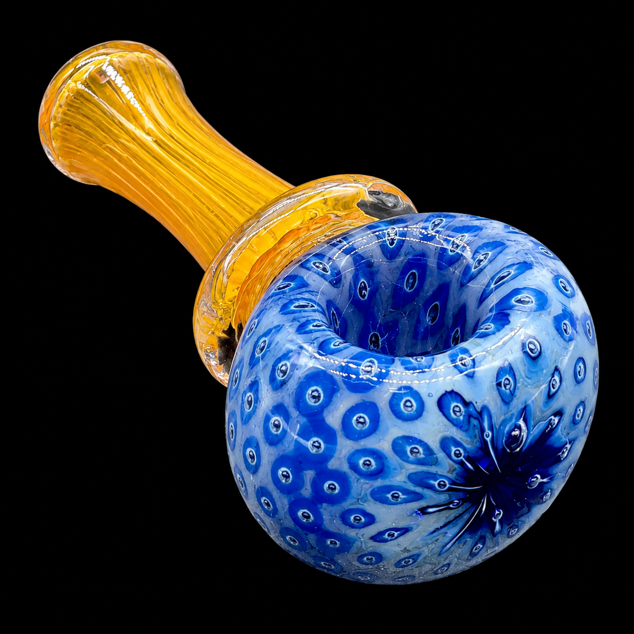 Glass smoking pipe with blue and yellow design on a black background