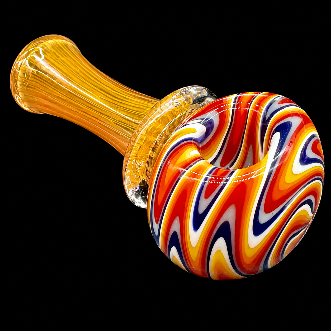 Glass smoking pipe with colorful swirl design on a black background