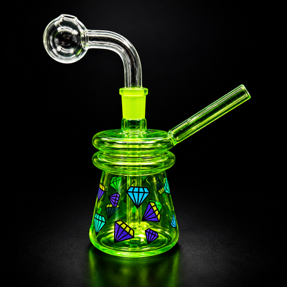 Green glass smoking device with geometric patterns on a black background