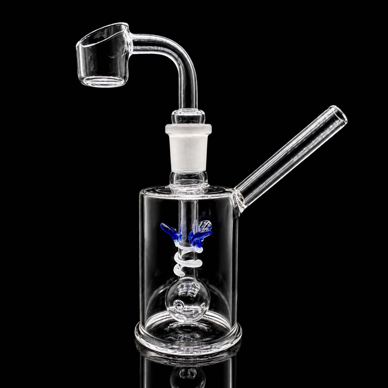 Clear glass water pipe with spiral design on a black background