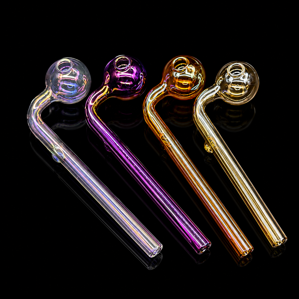 Four glass smoking accessories in different colors on a black background