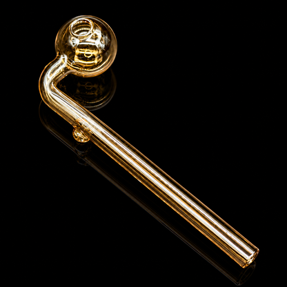 Gold-colored glass pipe on a black background