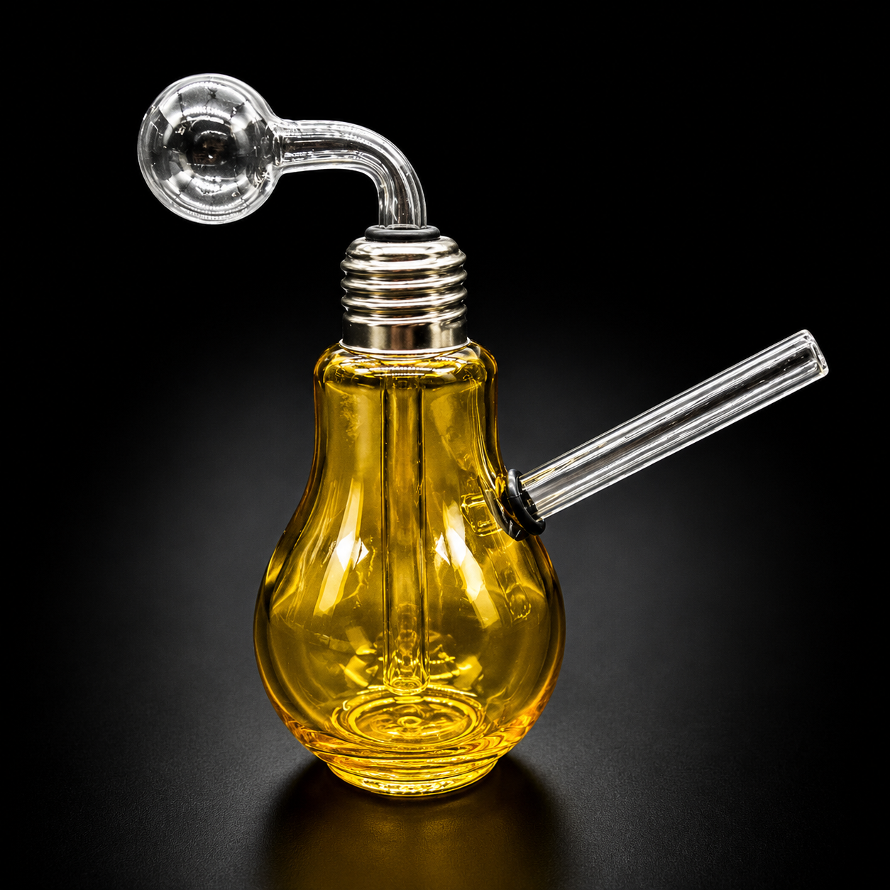 Glass smoking device shaped like a light bulb on a black background