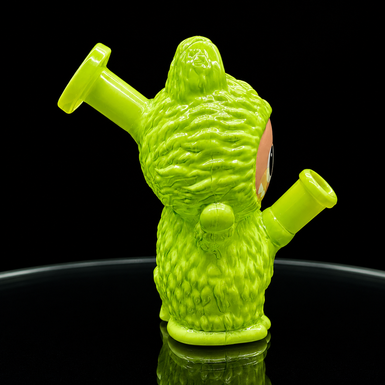 Green gnomish character with a smoking pipe on a black background