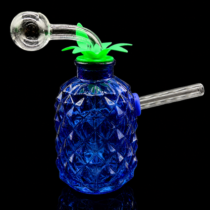 Blue glass pineapple-shaped smoking device with green top on a black background