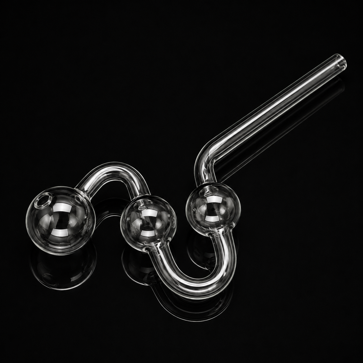 Glass smoking pipe with three spherical chambers on a black background