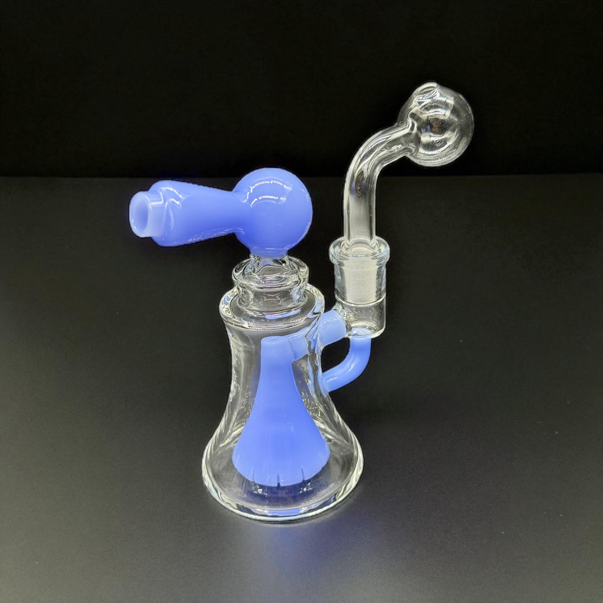 Glass smoking device with blue accents on a black background