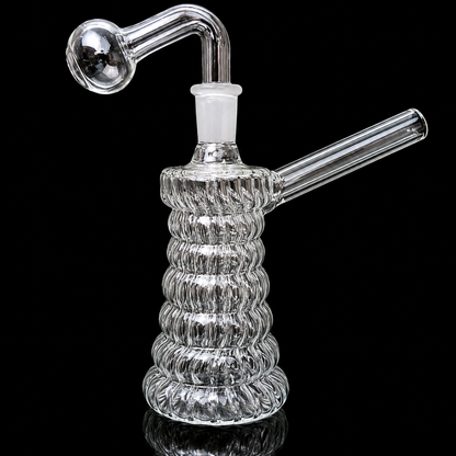 Clear glass water pipe with ribbed design on a black background