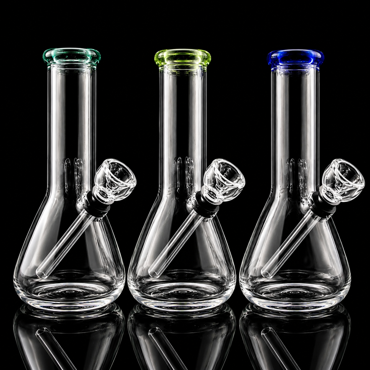 Three glass beaker-shaped smoking devices with colored tops on a black background