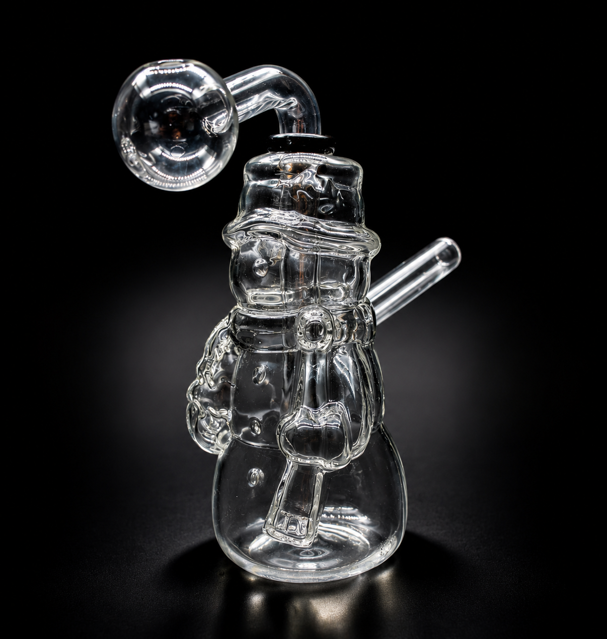 Clear glass snowman figure with a pipe on a black background