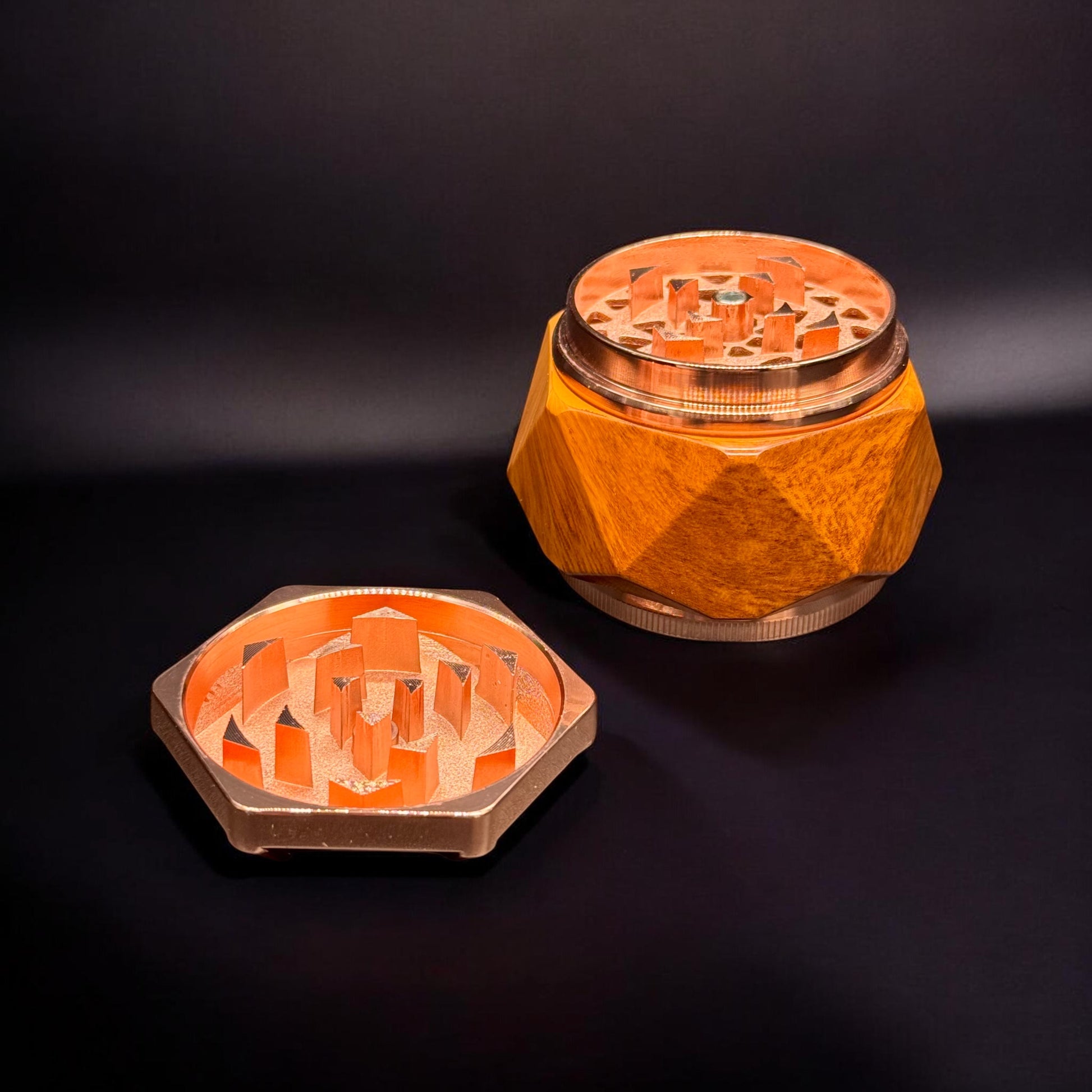 Wooden grinder with metallic accents on a dark background
