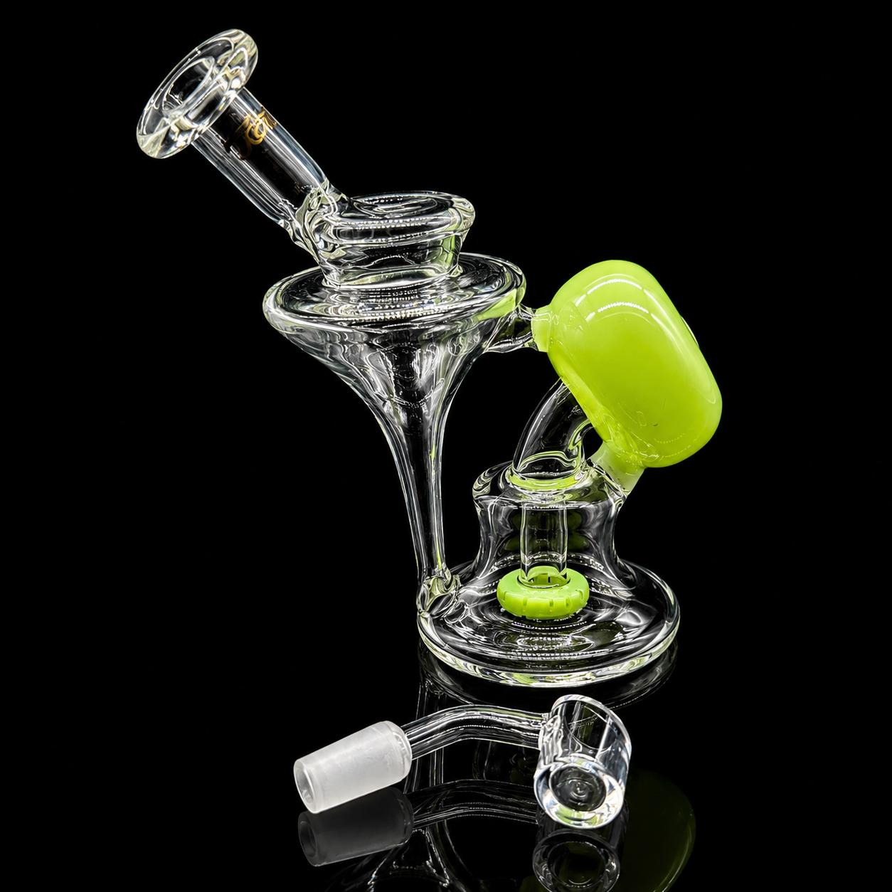 Glass smoking device with a green accent on a black background