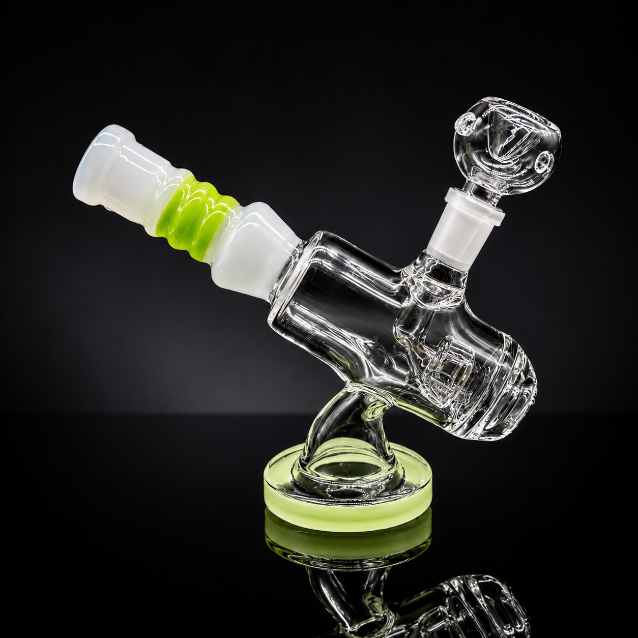 Glass smoking device with green accents on a reflective surface