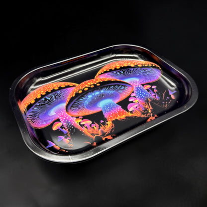 Colorful mushroom design on a metallic tray against a black background