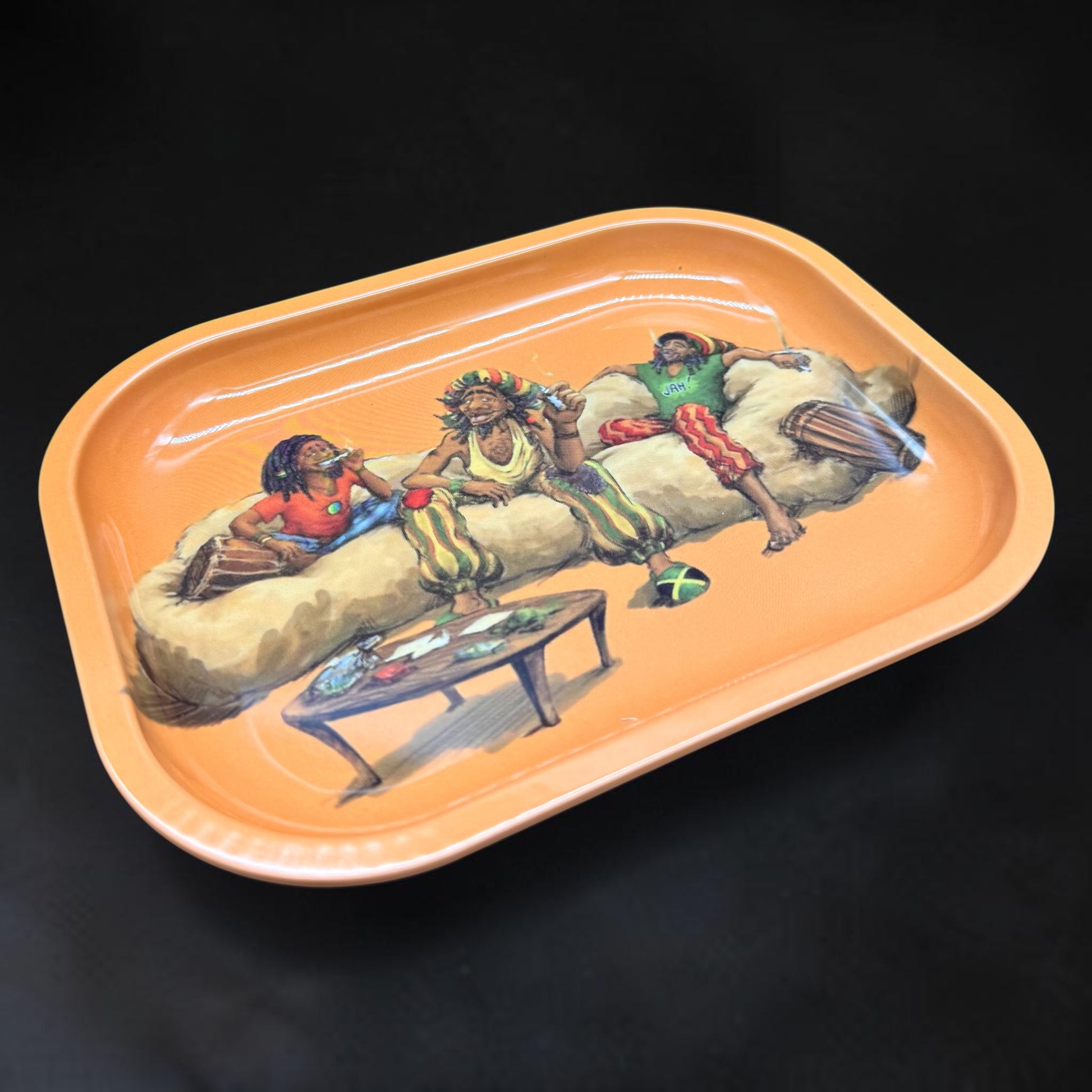 Decorative tray with artistic depiction of people on a couch against a black background
