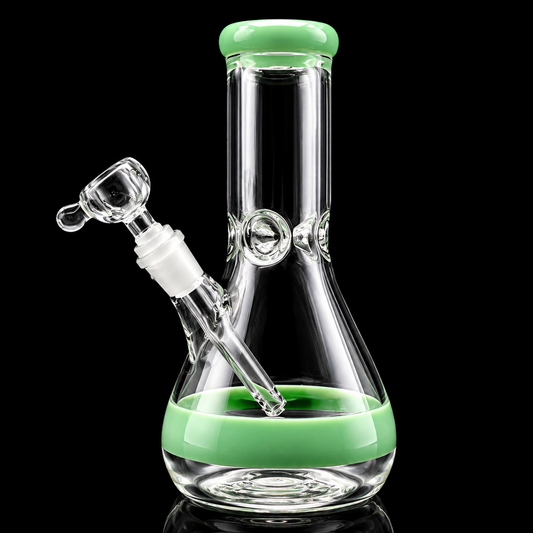 Glass smoking device with green accents on a black background