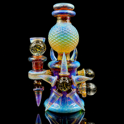Multicolored glass smoking accessory on a black background