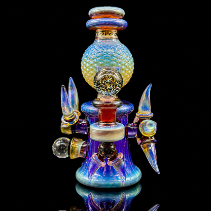 Colorful glass smoking accessory with multiple nozzles on a black background