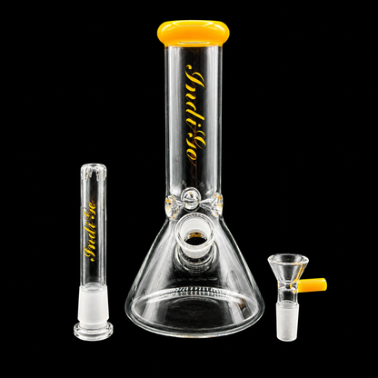 Glass smoking apparatus with yellow and black 'Indigo' branding on a black background