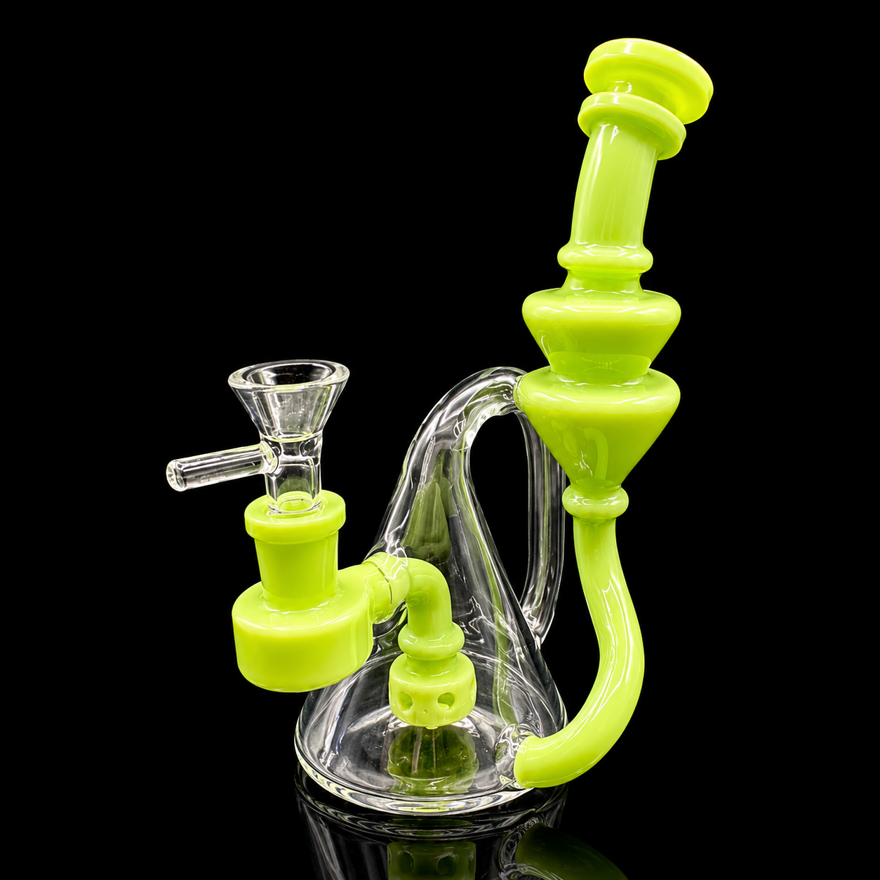 Glass smoking device with green accents on a black background