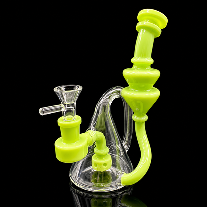 Glass smoking device with green accents on a black background