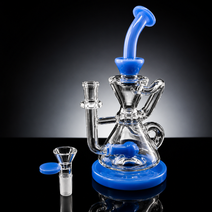 Glass water pipe with blue accents on a reflective surface