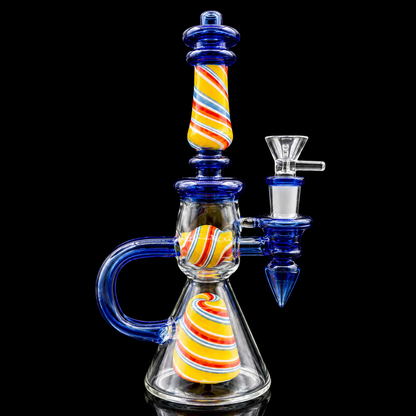 Glass smoking device with colorful striped design on a black background