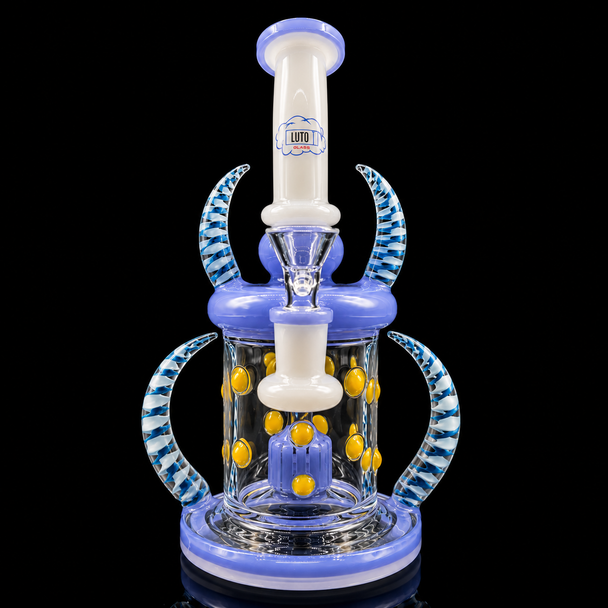 Glass water pipe with blue and white design on a black background