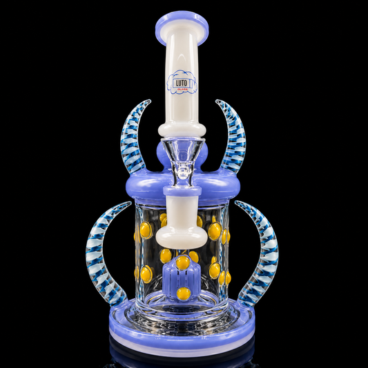 Glass water pipe with blue and white design on a black background