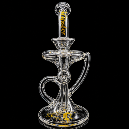 Clear glass smoking device with brand name on a black background