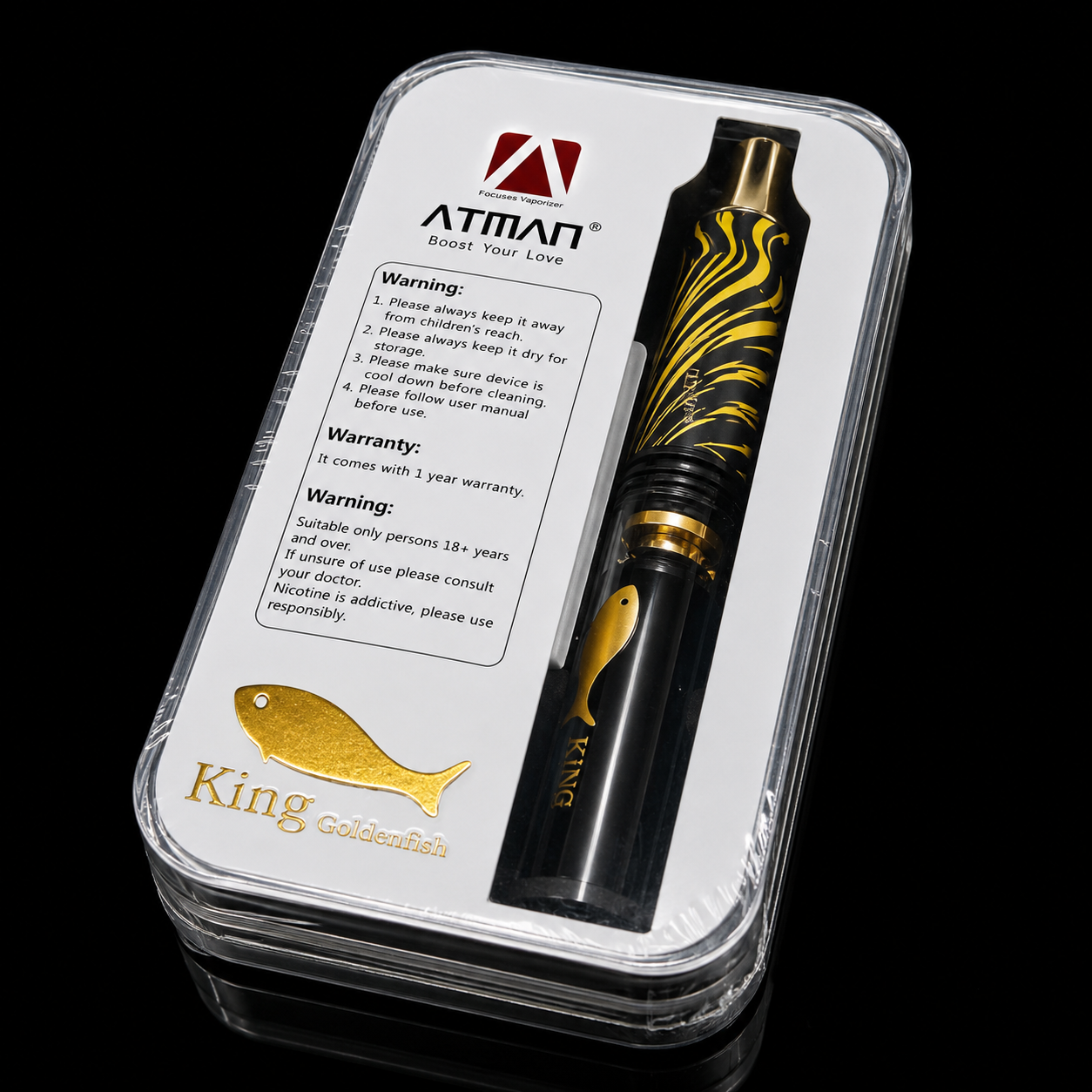 Vape pen with gold accents in a clear packaging case, featuring Atman branding.